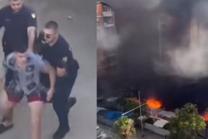 I riu tenton të hyjë mes zjarrit në Durrës për të shpëtuar rrobat e biznesit, policia nuk e lejon (Video)
